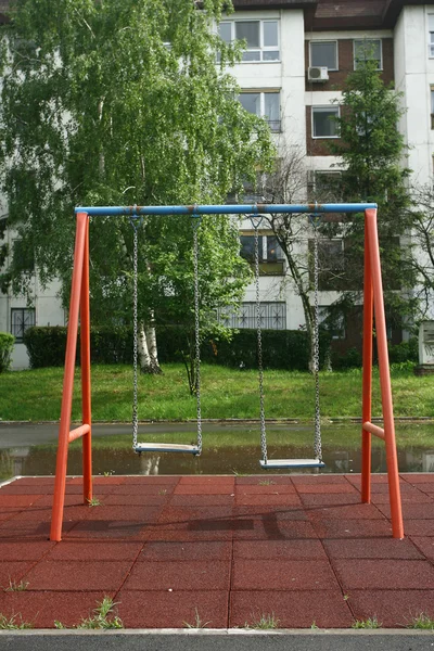 Playground children's child chain swings on summer kids playgrou — Stock Photo, Image