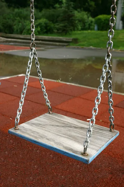 Playground children's child chain swings on summer kids playgrou — Stock Photo, Image