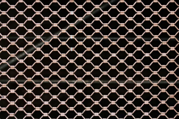 Metallic security net with black background — Stock Photo, Image