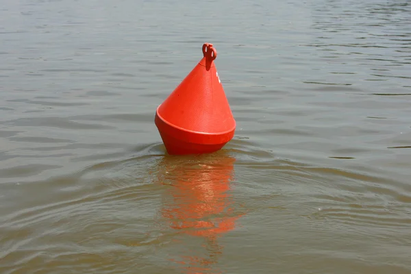 A red channel marker guides boats through the water, buoy for a — Stock Photo, Image