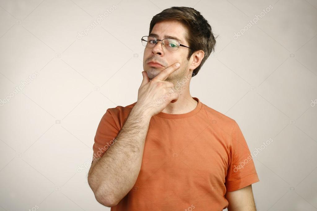 Caucasian Young Man Thinking Doubting and Considering a Decision