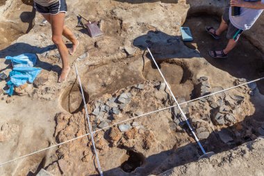 Yunatsite, Bulgaria - August, 02 2022: Archaeologists are working at Tell Yunatsite dig site.