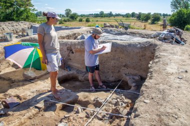 Yunatsite, Bulgaria - August, 02 2022: Archaeologists are working at Tell Yunatsite dig site.