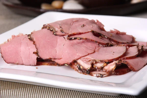 Sliced pastrami on a plate — Stock Photo, Image