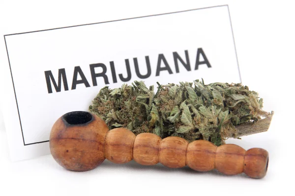 Marijuana bud and sign — Stock Photo, Image