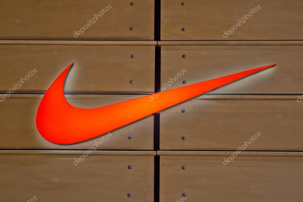 The Famous Nike Logo On A Wooden Wall