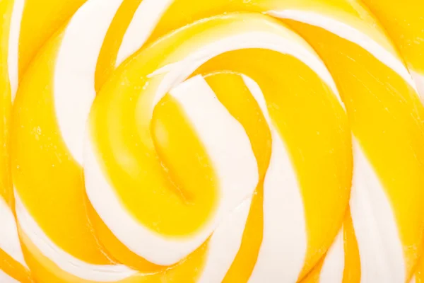 Dulce piruleta espiral amarilla — Foto de Stock