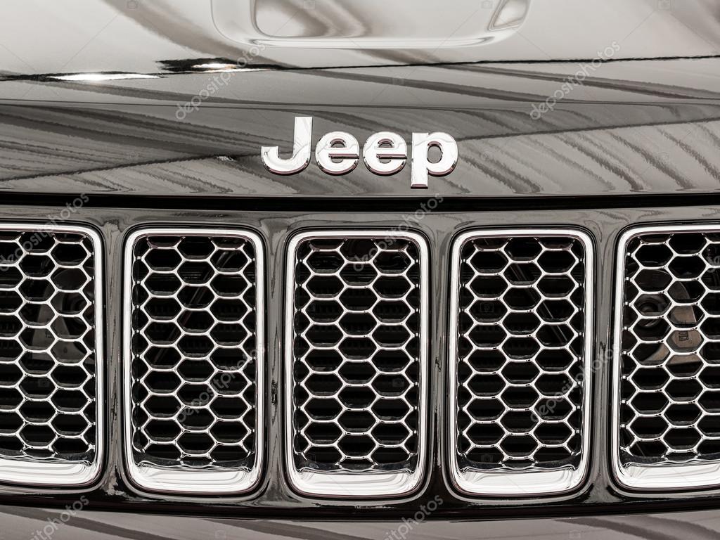 BUCHAREST, ROMANIA - APRIL 04, 2014: Jeep Grand Cherokee Sign Close Up. The Jeep Grand Cherokee has always used a unibody chassis and is an SUV produced by the Jeep division of Chrysler.
