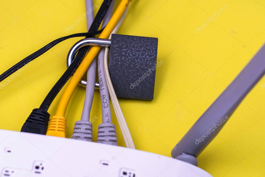padlock on internet cables coming out of the modem concept information protection cybersecurity censorship on the Internet. High quality photo