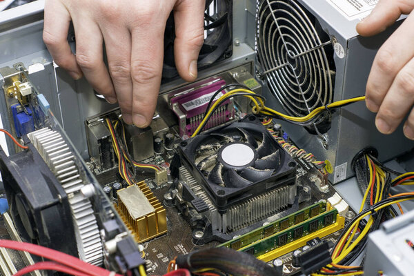 the master repairs an old dusty computer