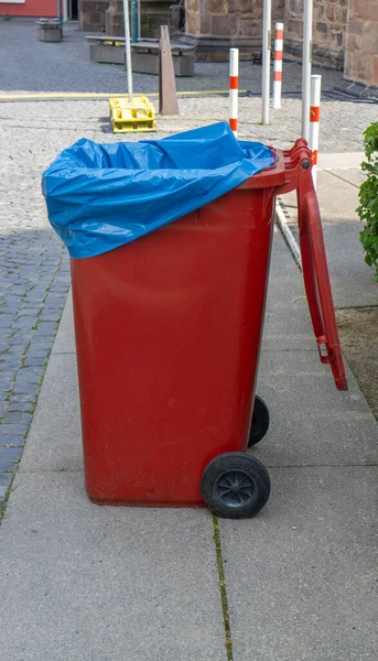 Red Opened Garbage Bin Blue Garbage Bag — 스톡 사진