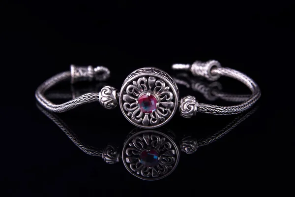 Beautiful silver bracelet on black background — Stock Photo, Image