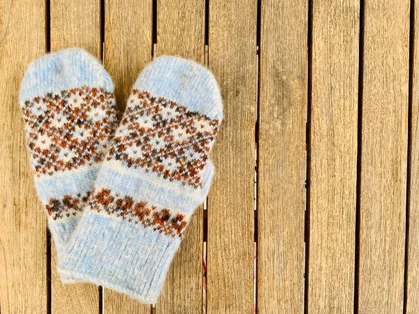 Blue mittens on wooden background copy space — Stock Photo, Image