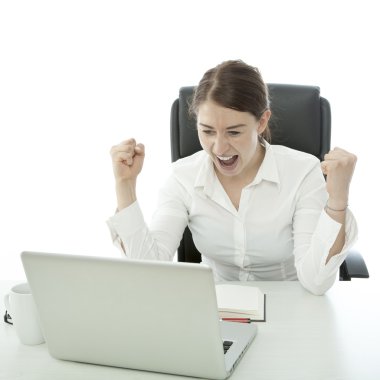 young brunette business woman is happy behind her laptop clipart
