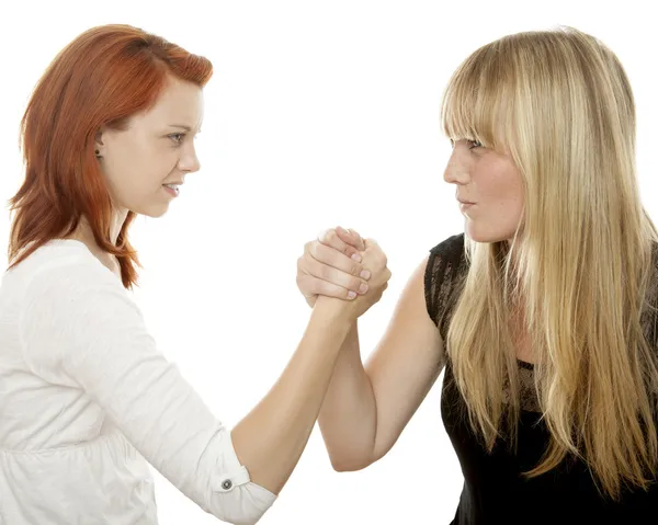 Young beautiful red and blond haired girlsbattle each other — Stock Photo, Image