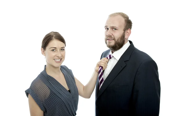 Young brunette woman and beard business man pull tie — Stock Photo, Image