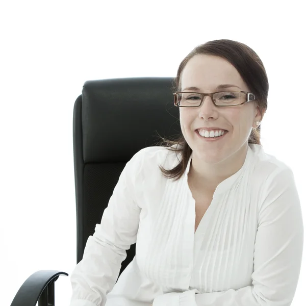 Young brunette businesswoman with glasses smiling bright — Stock Photo, Image