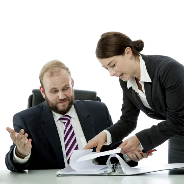 Beard business man brunette woman at desk confuse Stock Image