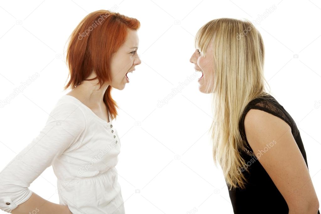 young beautiful red and blond haired girls shout to each other
