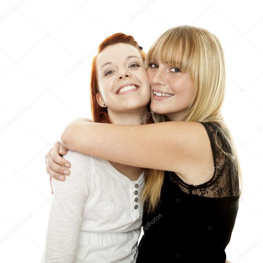 young beautiful red and blond haired girls hugs