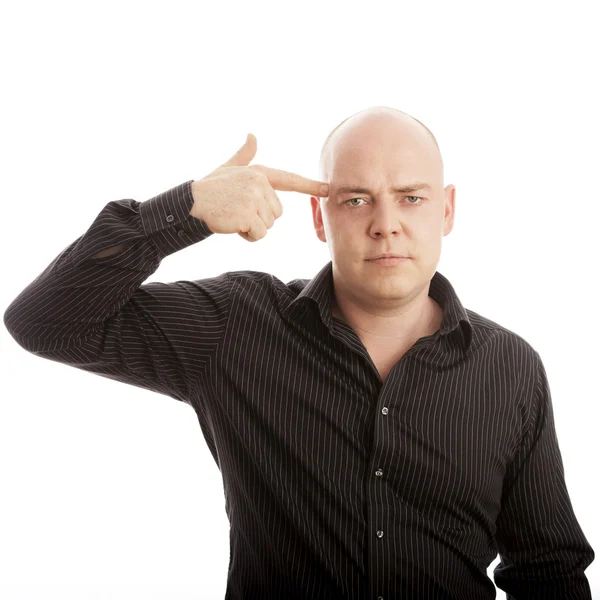 Homem careca com o dedo na cabeça — Fotografia de Stock