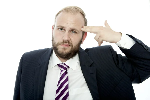 Uomo d'affari barba con pistola dito alla testa — Foto Stock