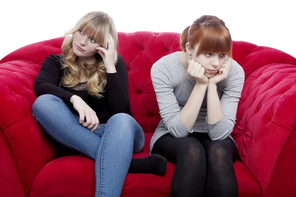 Young beautiful blond and red haired girls are bored and depress — Stock Photo, Image