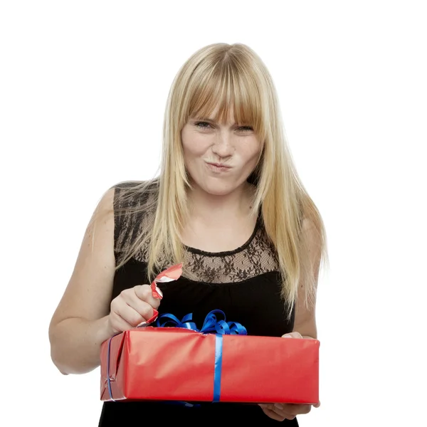 Young beautiful blond haired girl open gift — Stock Photo, Image