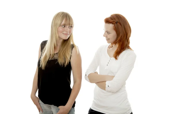 Young beautiful red and blond haired girls like each other — Stock Photo, Image