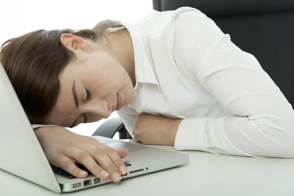 Young brunette business woman fall asleep on her computer — Stock Photo, Image