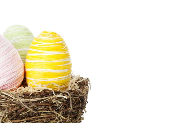 Colourful Easter eggs in a nest — Stock Photo, Image