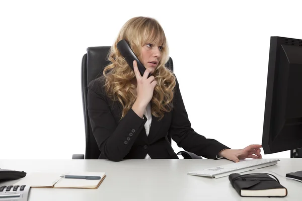 Young businesswoman multitasking — Stock Photo, Image