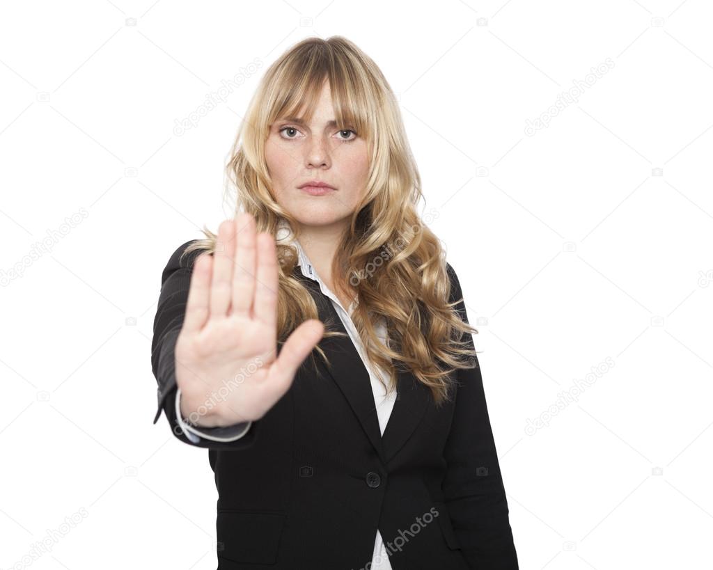 Stern businesswoman making a stop gesture