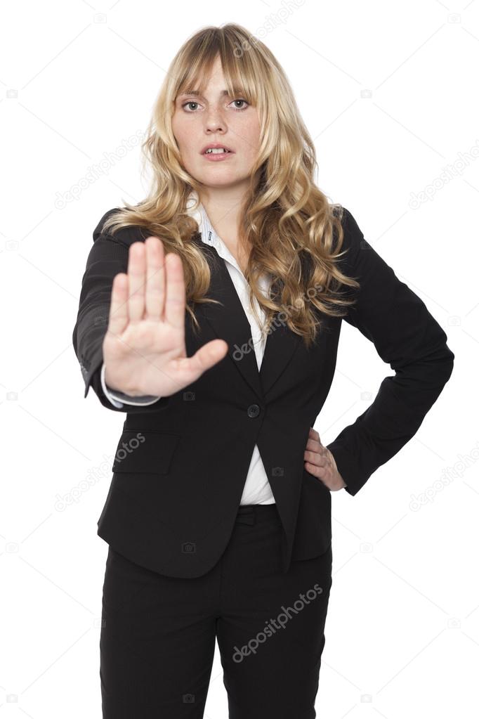 Businesswoman giving a halt gesture