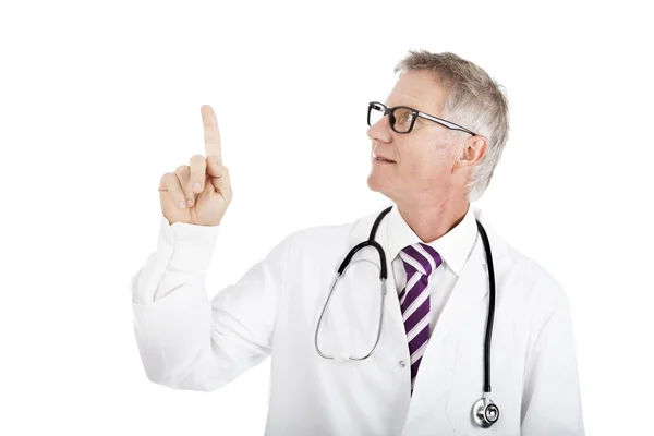 Doctor pointing above his head and looking up — Stock Photo, Image