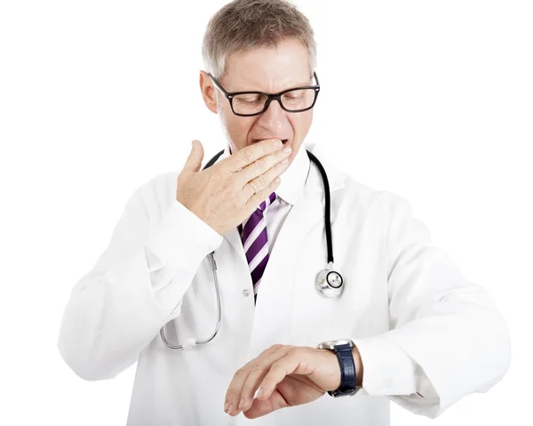 Doctor gesturing at his watch — Stock Photo, Image