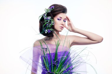 Orkide çiçek ve profesyonel makyaj güzellik kız