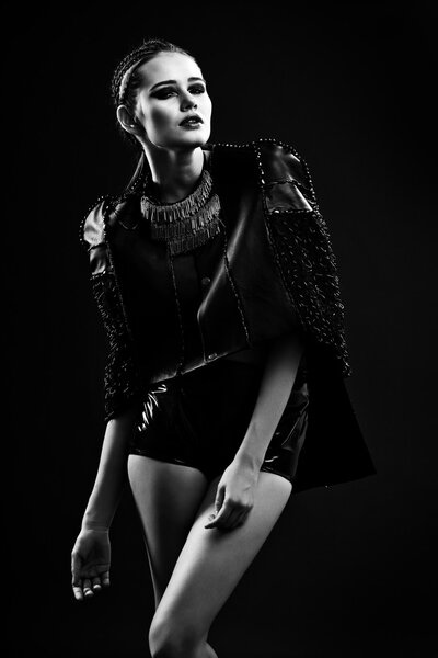 Beautiful young woman in leather jacket