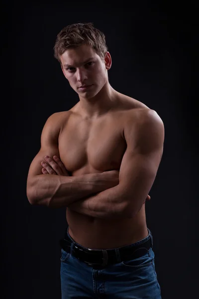 Muscle sexy naked young man posing in jeans — Stock Photo, Image