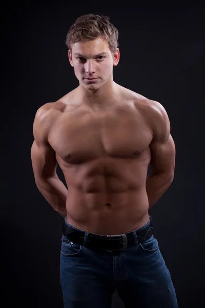 Muscle sexy naked young man posing in jeans — Stock Photo, Image