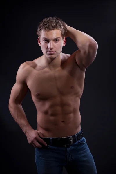 Muscle sexy naked young man posing in jeans — Stock Photo, Image