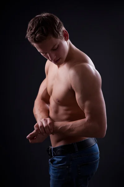 Muscle sexy naked young man posing in jeans — Stock Photo, Image