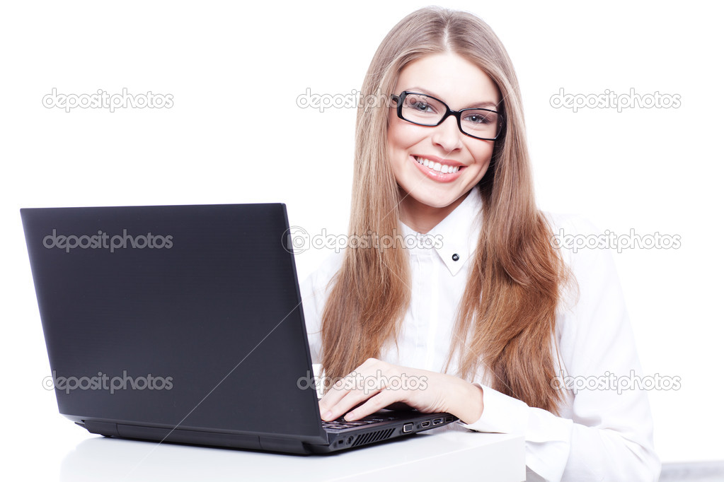 Young businesswoman, secretary or student working on laptop