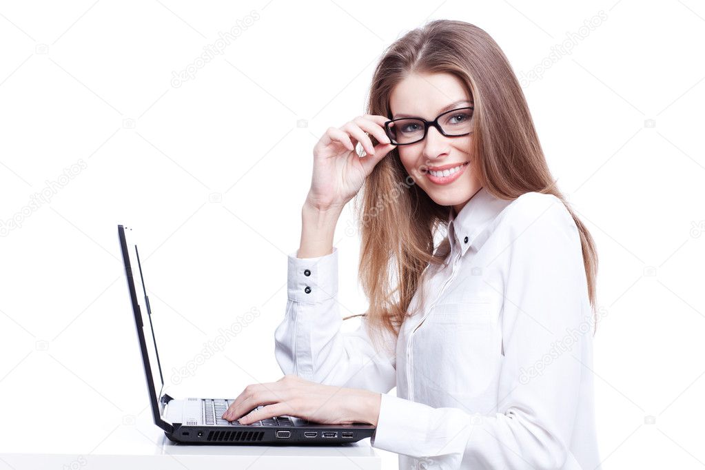 Young businesswoman, secretary or student working on laptop