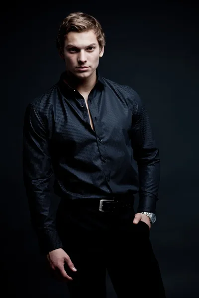 Portrait of sexy macho man over dark background — Stock Photo, Image