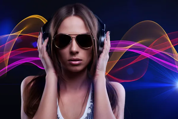 Woman DJ enjoying the music in the headphones — Stock Photo, Image