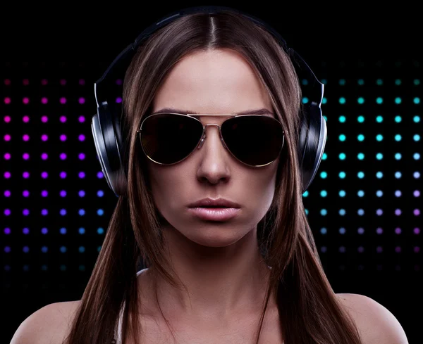 Young DJ woman enjoying the music in the headphones — Stock Photo, Image