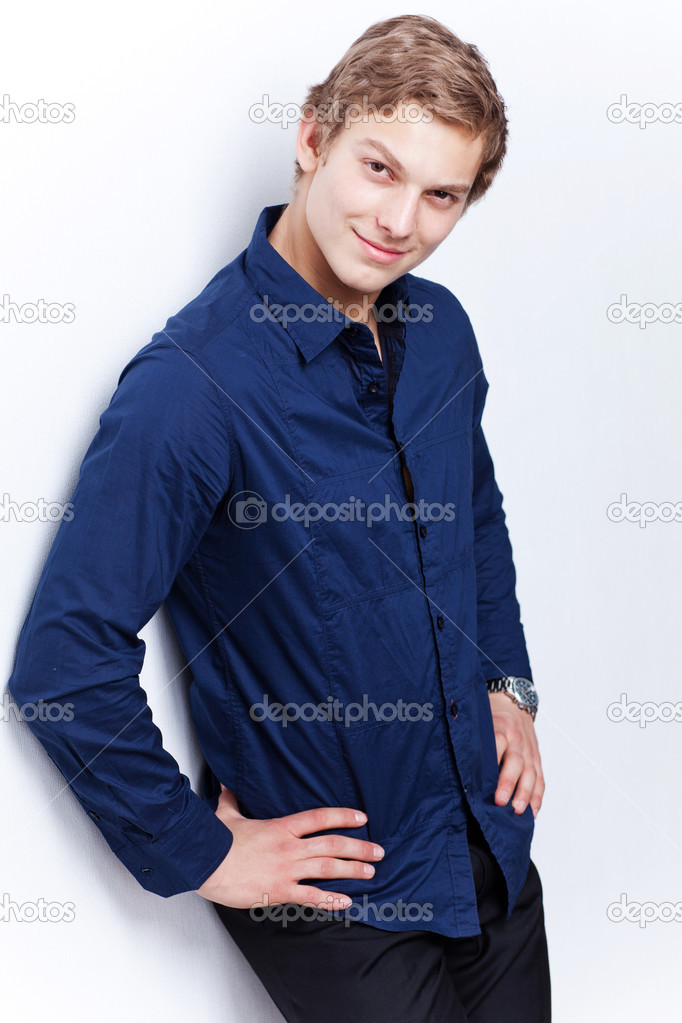 Portrait of a young handsome man wearing blue shirt