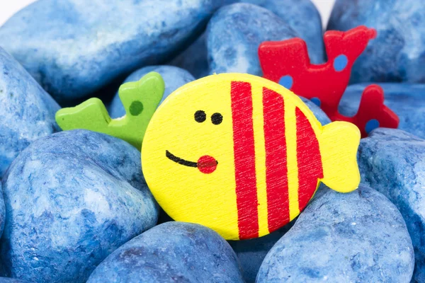 A yellow wood fish under the sea with blue stonge — Stock Photo, Image