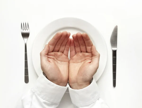 Rezando por comida isolada em branco . — Fotografia de Stock